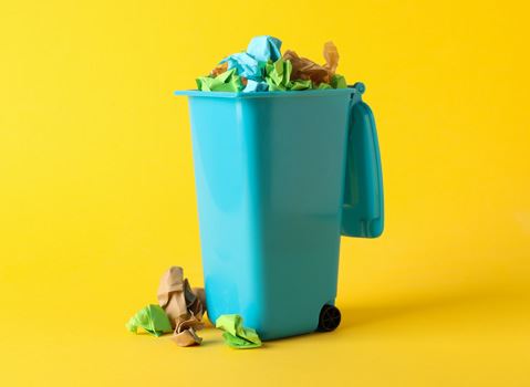 Garbage can with litter in it